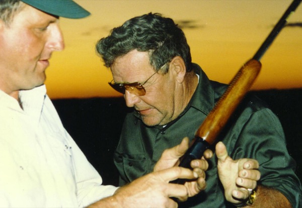 Labor Day Mo-Skeet Champion, Hart Johnson (1927-2004), handing off the gun after breaking a perfect 18 x 18 Mo-Skeet targets.