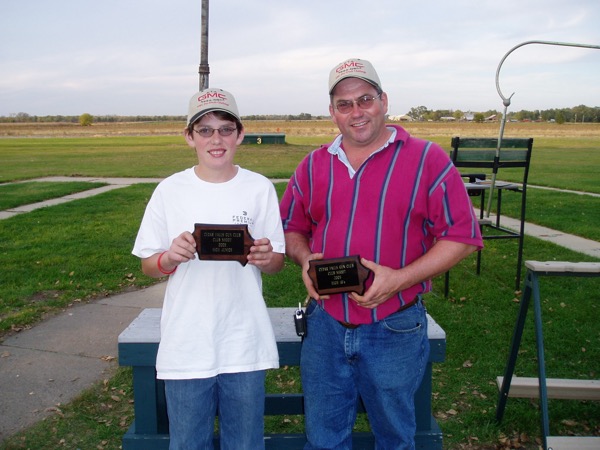 35 years later; 2005 Cedar Falls Club shoot Junior Champion, Matthew Stockdale along side 2005 Cedar Falls Club shoot Singles Champion, Dale Stockdale. Matthew's first trophy.